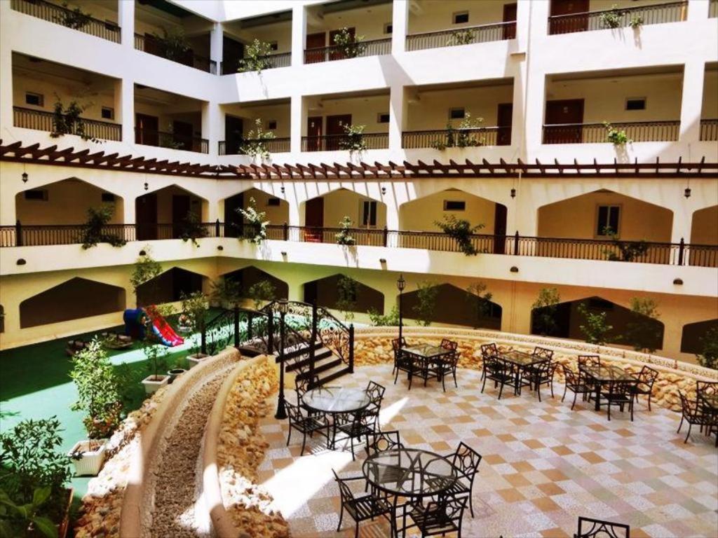 Johny International Hotel Muskat Bagian luar foto